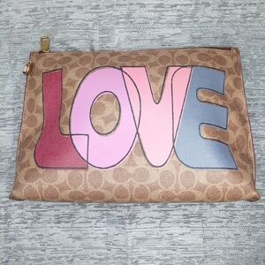 Coach Tan Clutch with Love Graphic